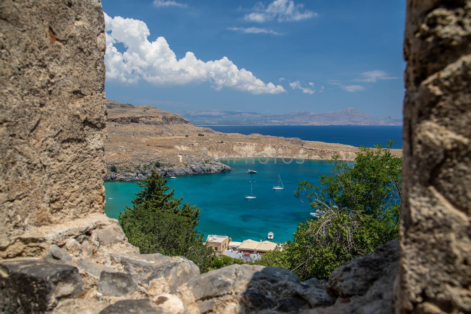 View on a beautiful bay from the acropolis of Lindos on rhodes island in greece