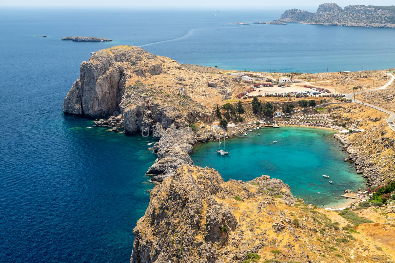 Scenic view from the acropolis of Lindos at the coastline of the by reinerc