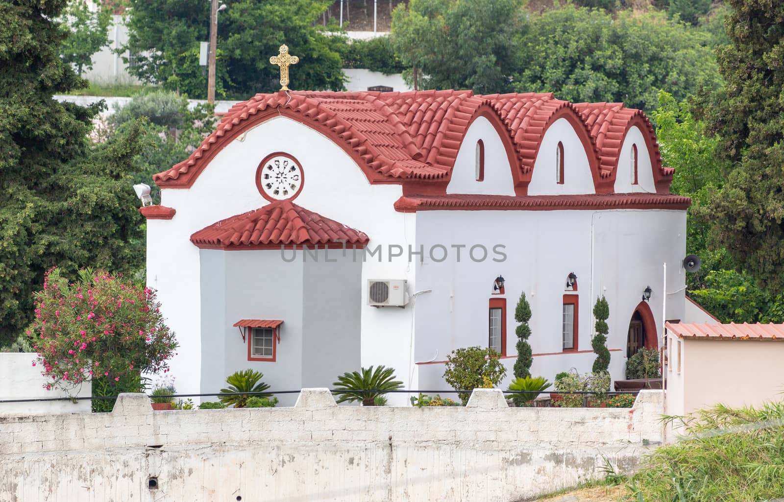 Church with red roof in Platania on Rhodes island, Greece