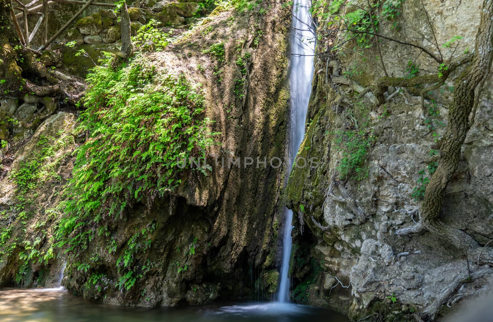 Waterfall in Petaloudes, the valley of butterflies on Greek island Rhodes. Picture with long exposure