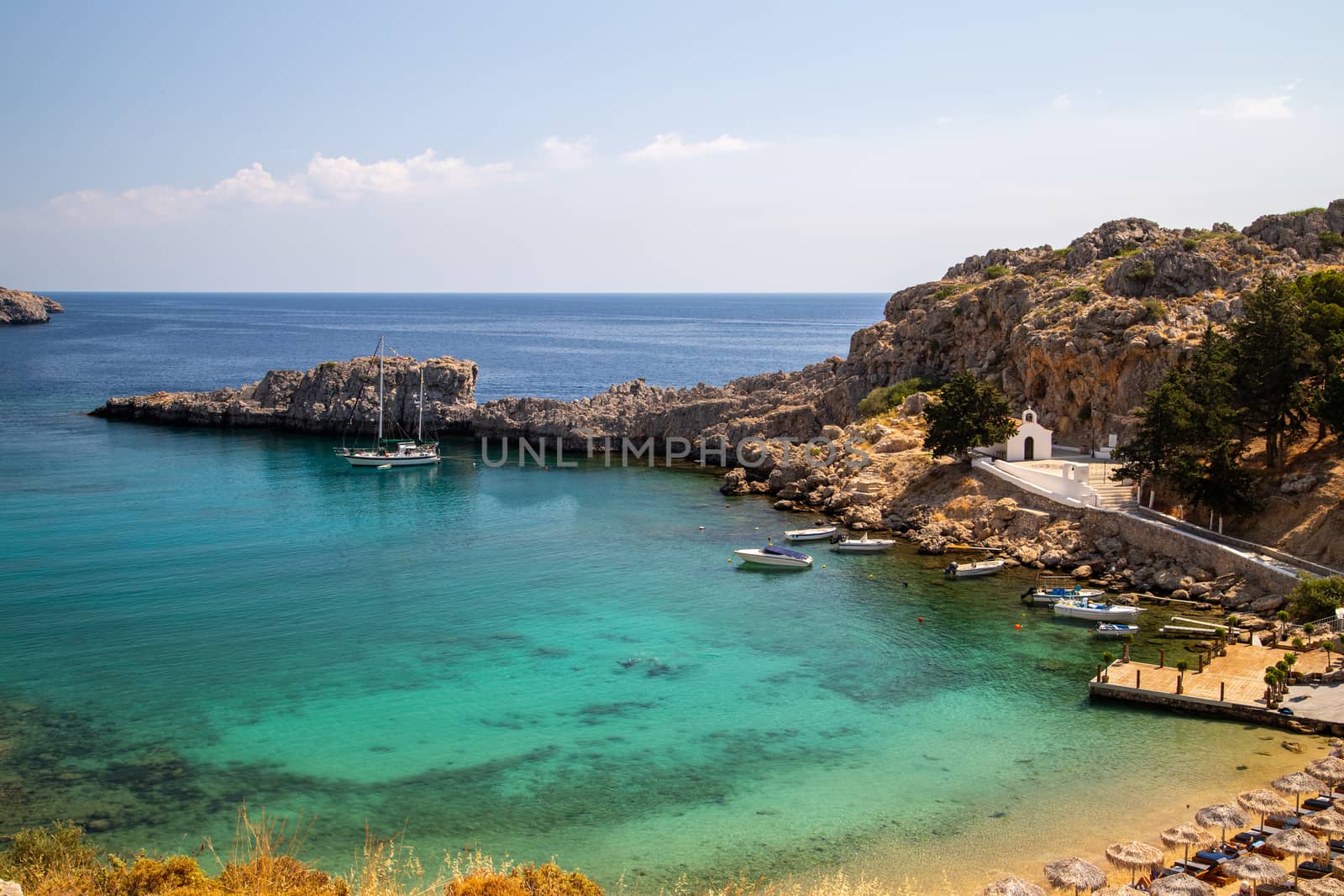 Scenic view at St. Pauls bay in Lindos on Rhodes island, Greece on a sunny day 