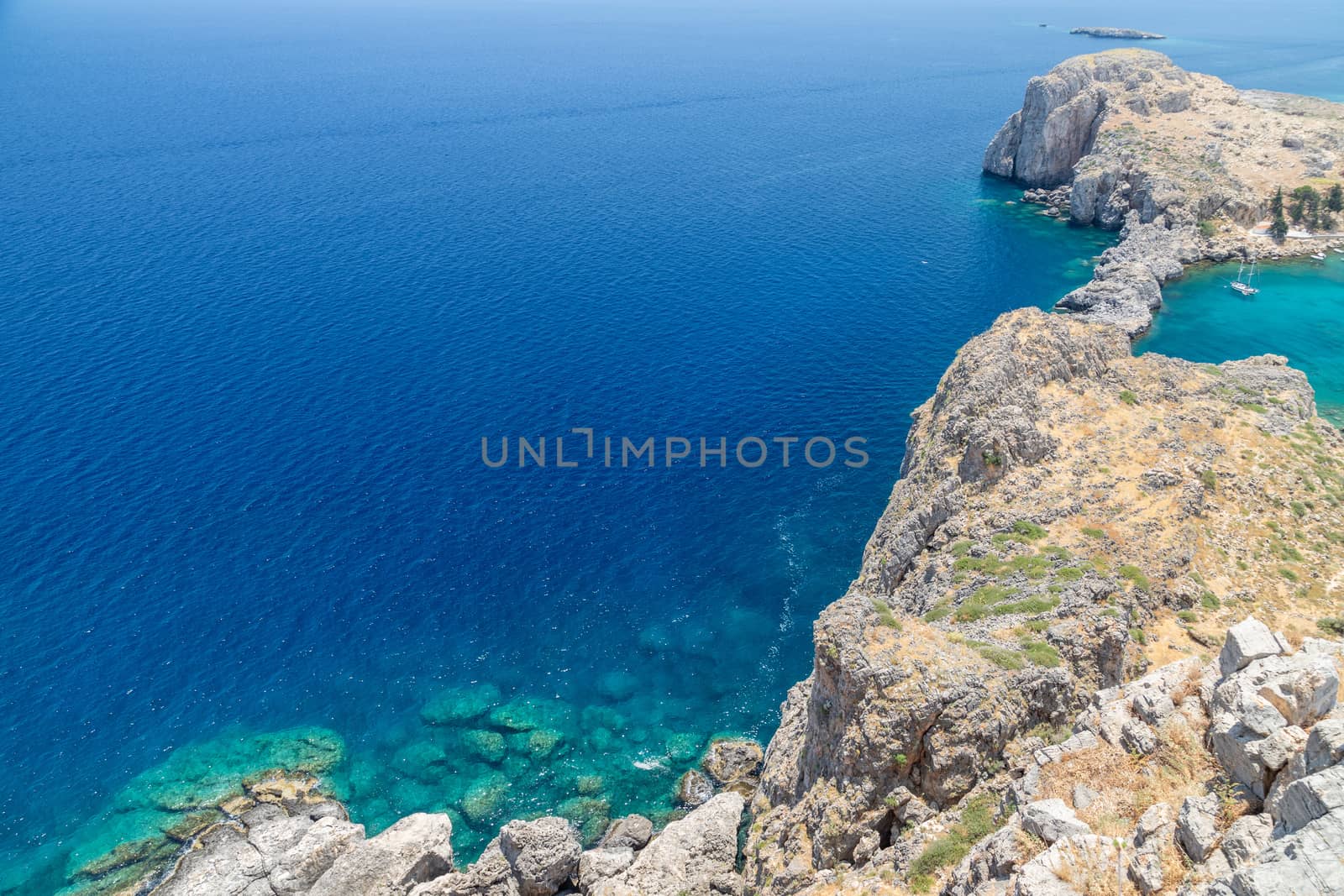 Scenic view from the acropolis of Lindos at the coastline of the by reinerc