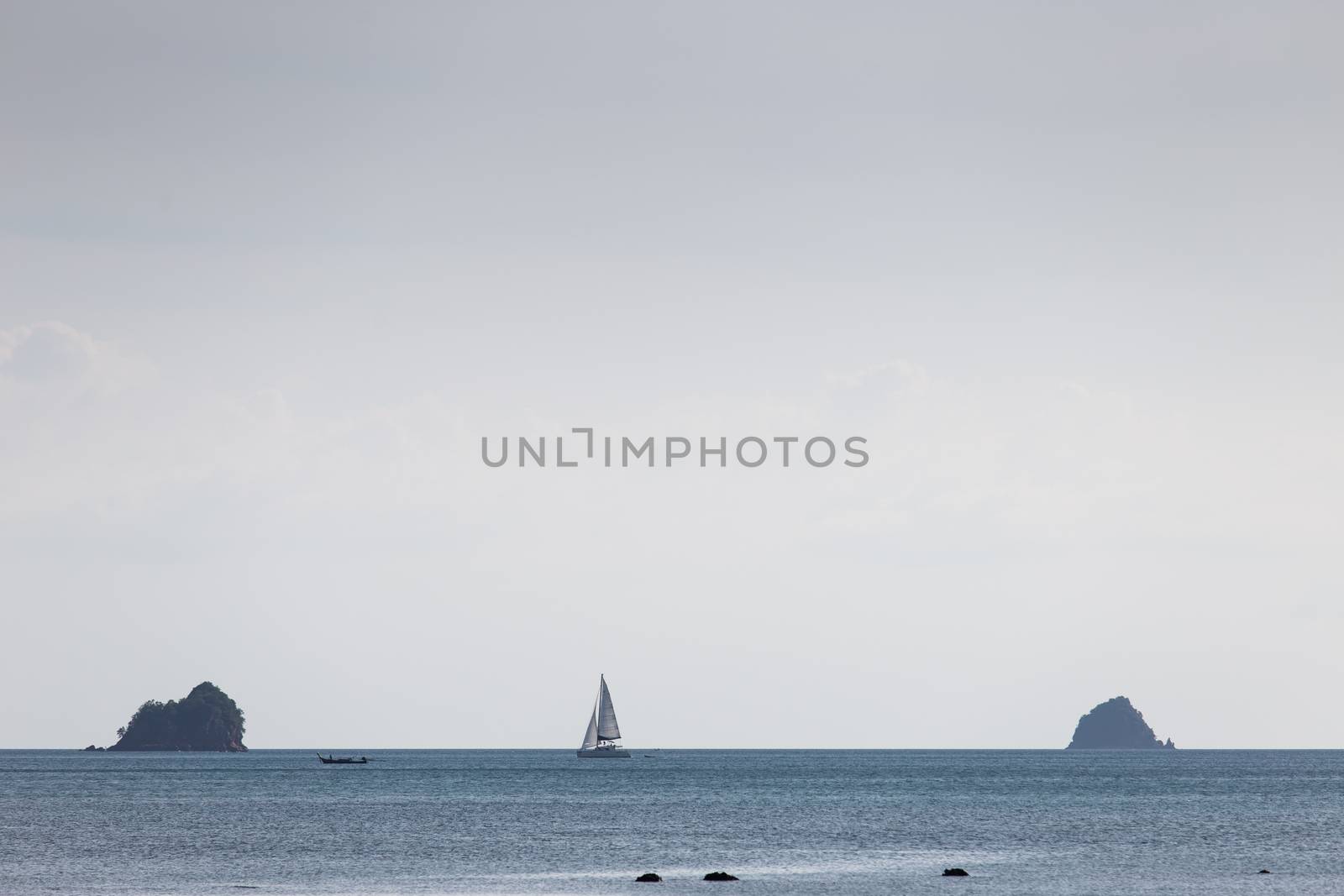 Krabi Thailand 12.16.2015 looking out to sea with sailing boat on horizon by kgboxford