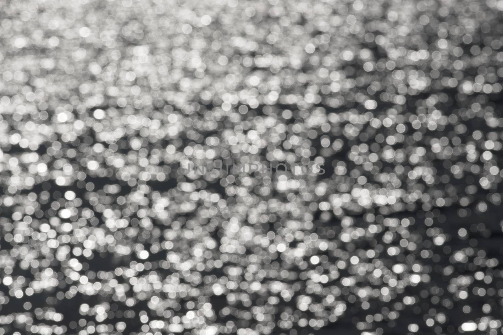 2 - Full frame plain abstract textured water bokeh round circles background. Random pattern effect of white circles on a dark grey background