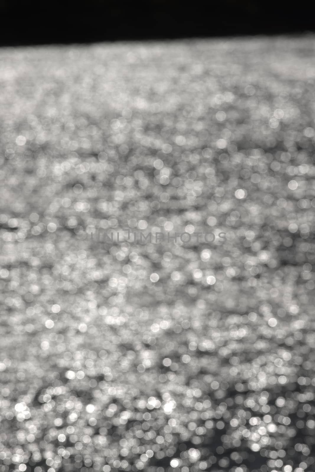 4 - Dense abstract textured bokeh background, vertical image, random bright white blurred pattern effect. outdoors inspiration, defocused technique