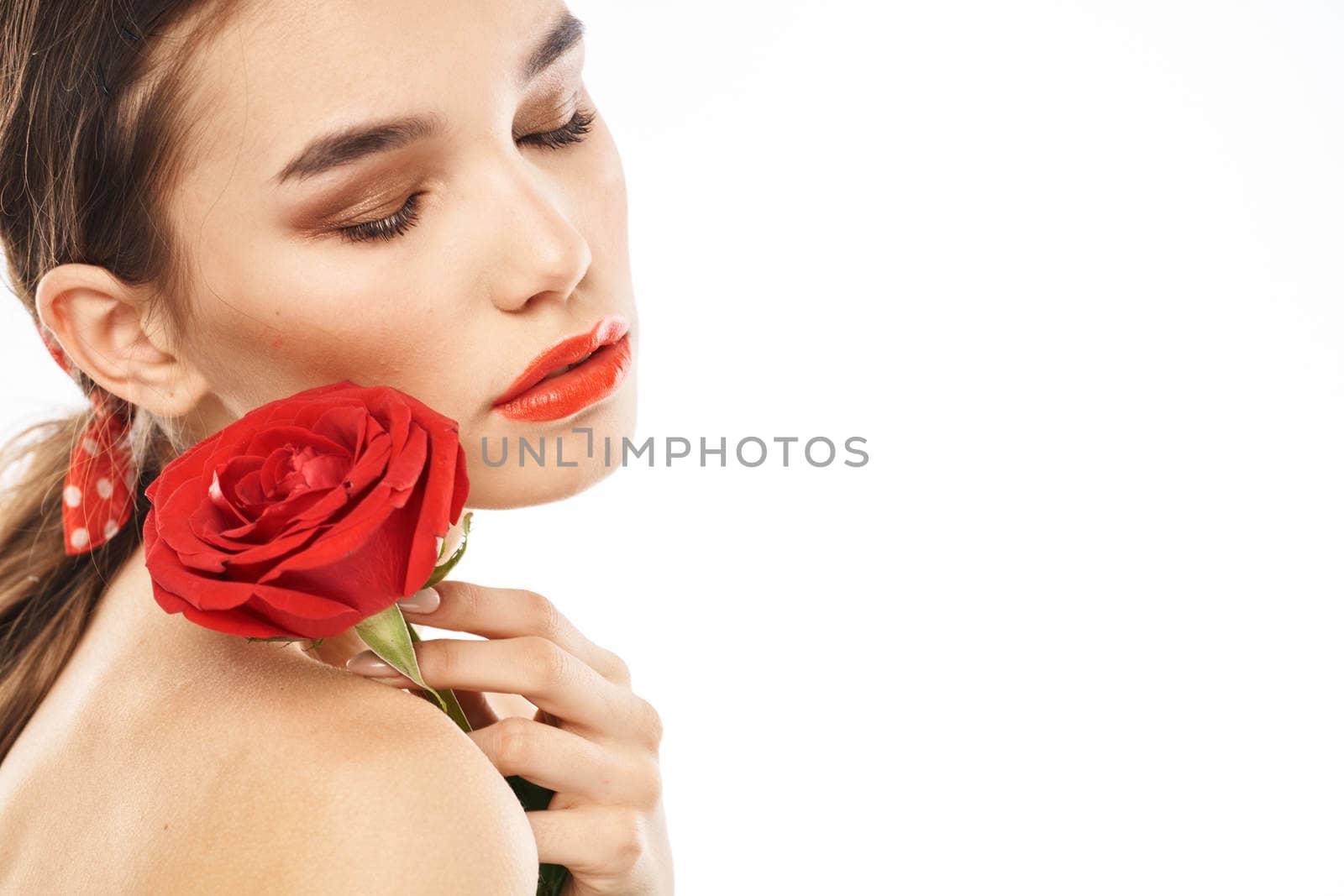 Beautiful woman with red rose near face makeup naked shoulders portrait by SHOTPRIME