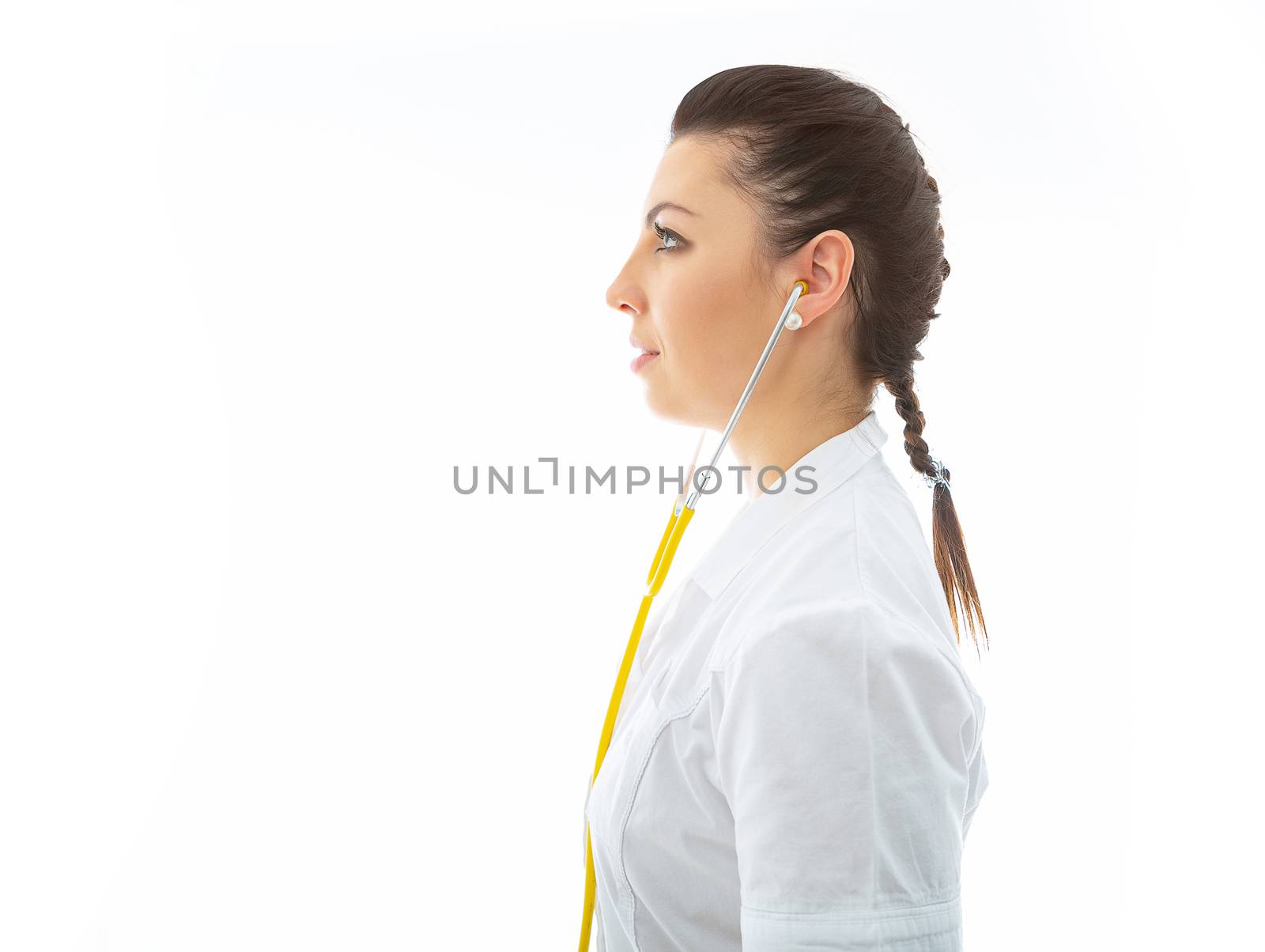 young brunette doctor in white wearing and stethoscope by fotoduki