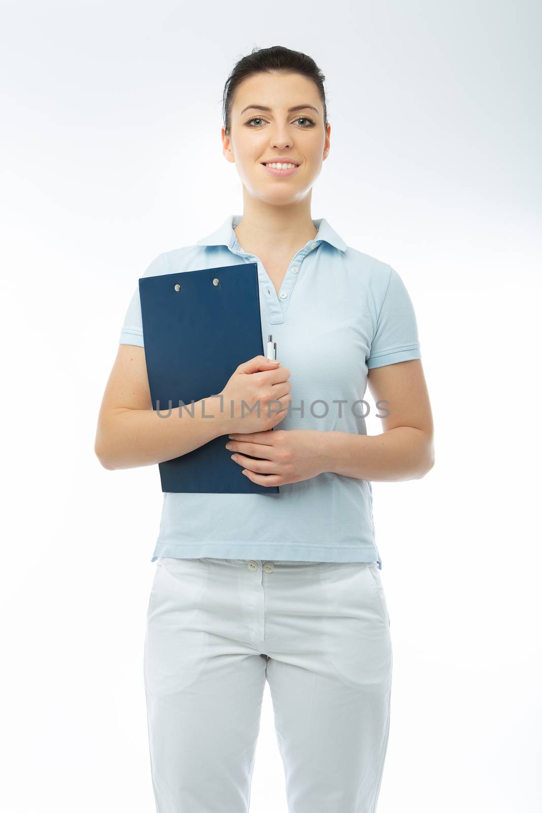 brunette doctor in white wearing with blue diary