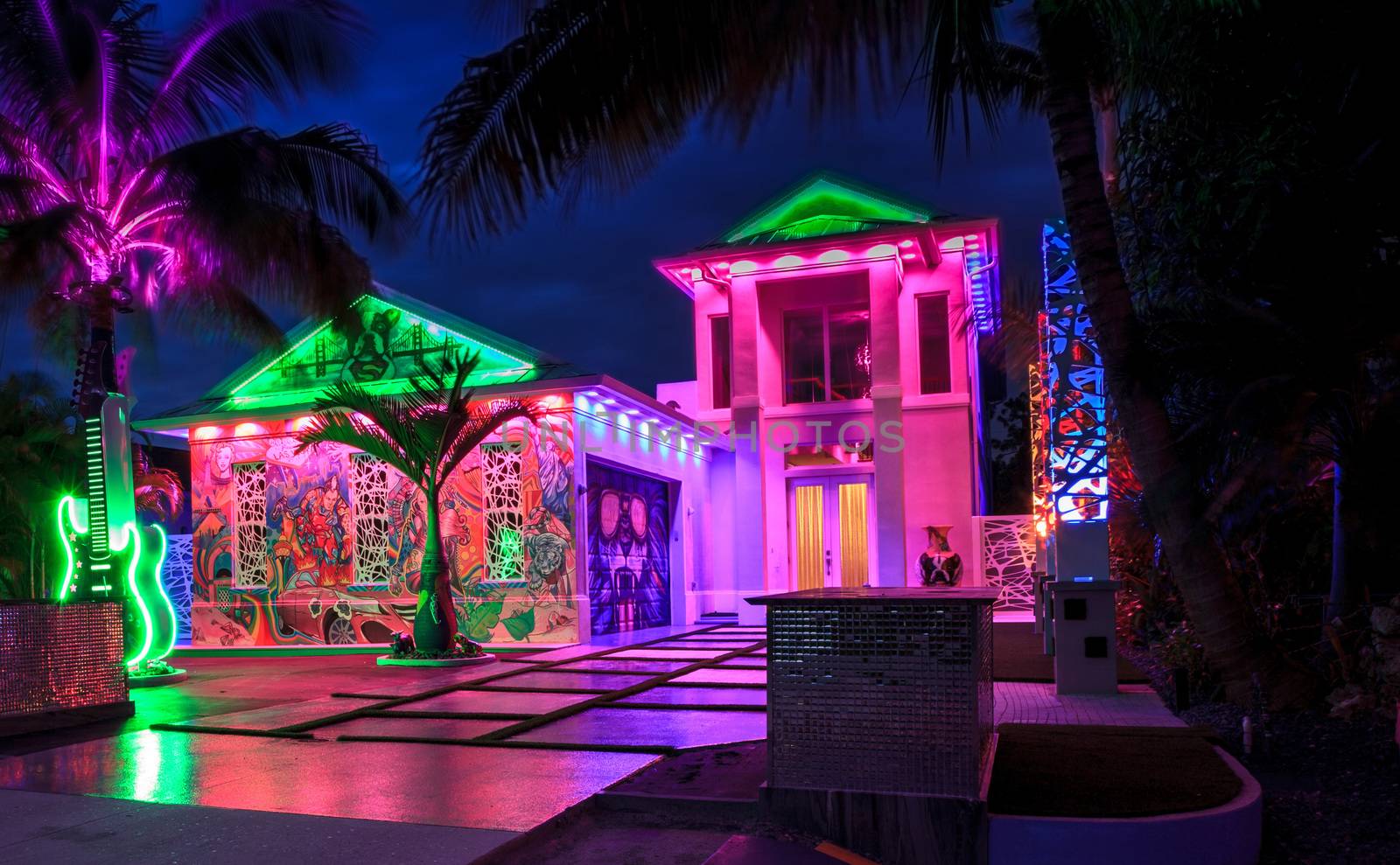 Naples, Florida, USA – October 23, 2020: Fun, colorful, artistic house done in the creative style of Las Vegas with neon lights sits in Naples Park, Florida. Editorial use only.