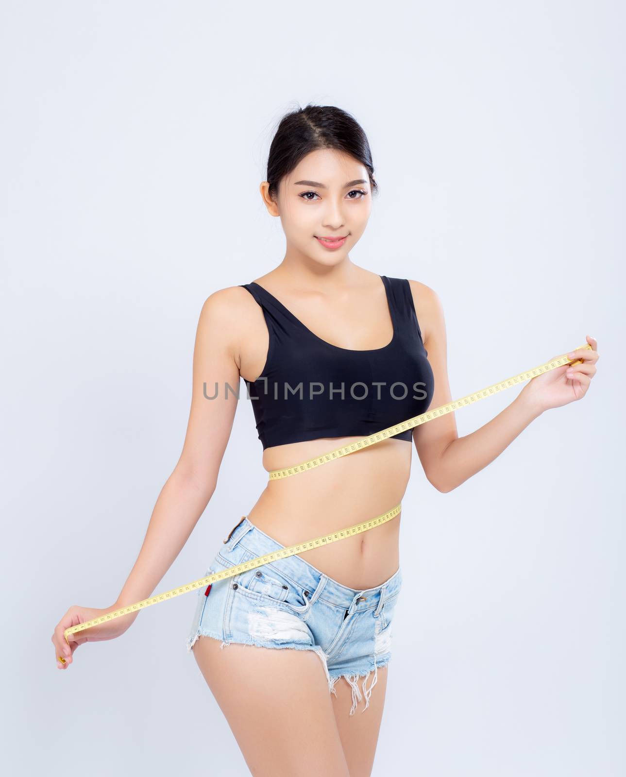 beautiful portrait asian woman diet and slim with measuring waist for weight isolated on white background, girl have cellulite and calories loss with tape measure, health and wellness concept.