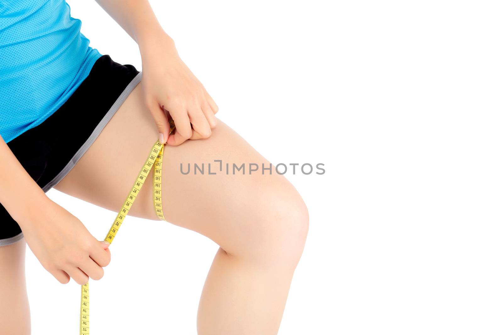 Closeup caucasian leg slim of woman with measure isolated on white background, girl wear sport with measuring centimeter tape for healthy and diet, cellulite and calories for health care.