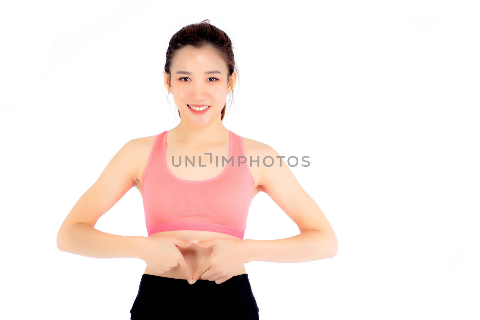 Beautiful portrait asian woman hand gesture heart shape on belly by nnudoo