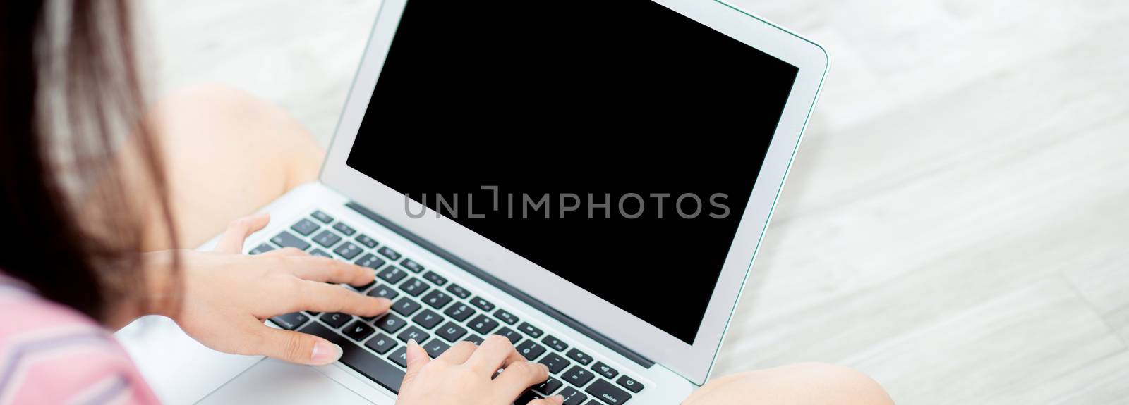 Banner website asian young woman sitting using laptop computer a by nnudoo