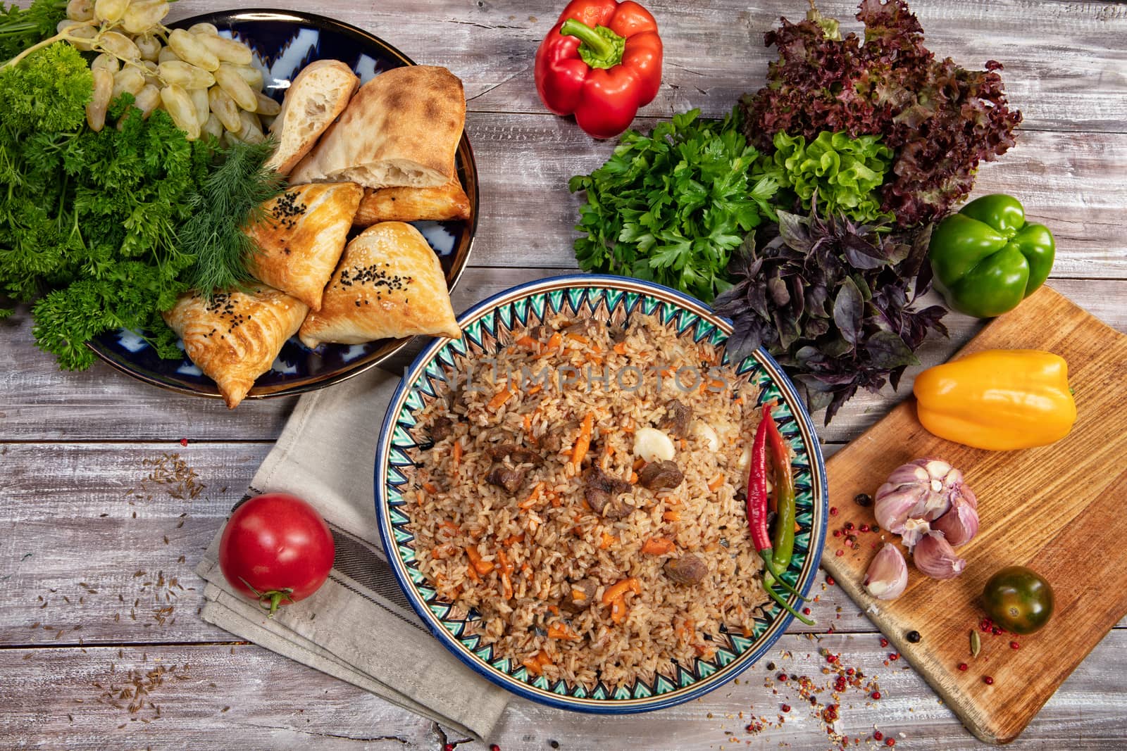 Asian traditional food and vegetables on an old wooden table