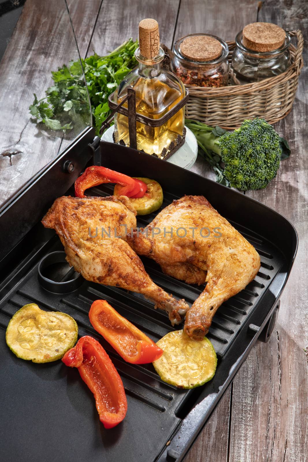 Roasted chicken and vegetables on a wooden table