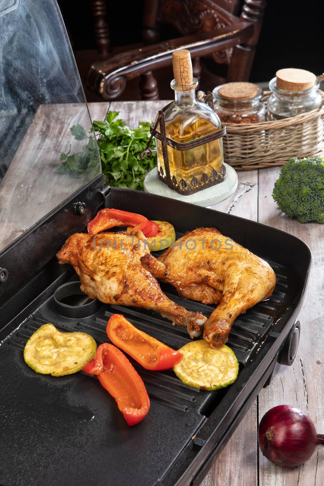 Roasted chicken and vegetables on a wooden table