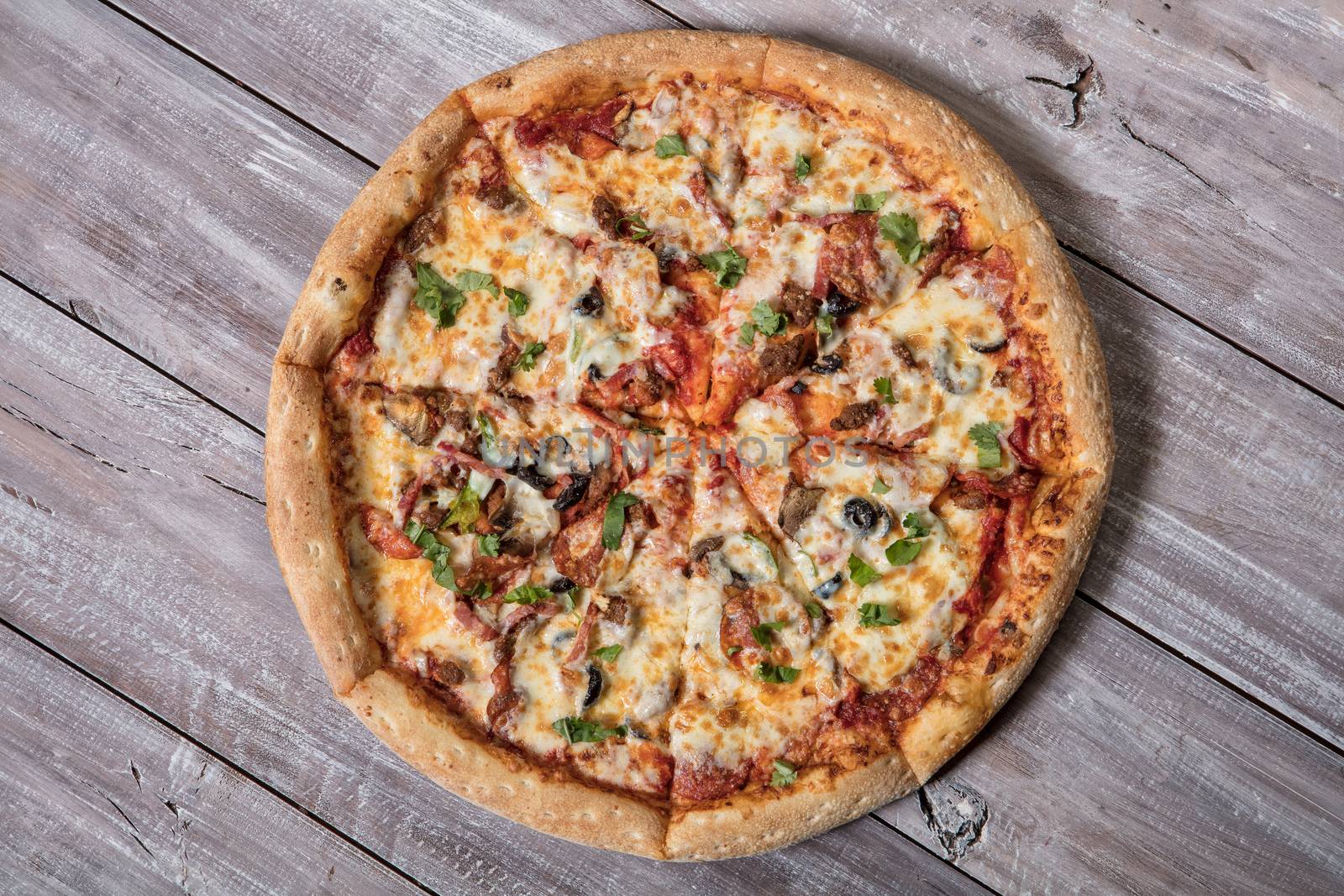 Pizza on an old wooden table