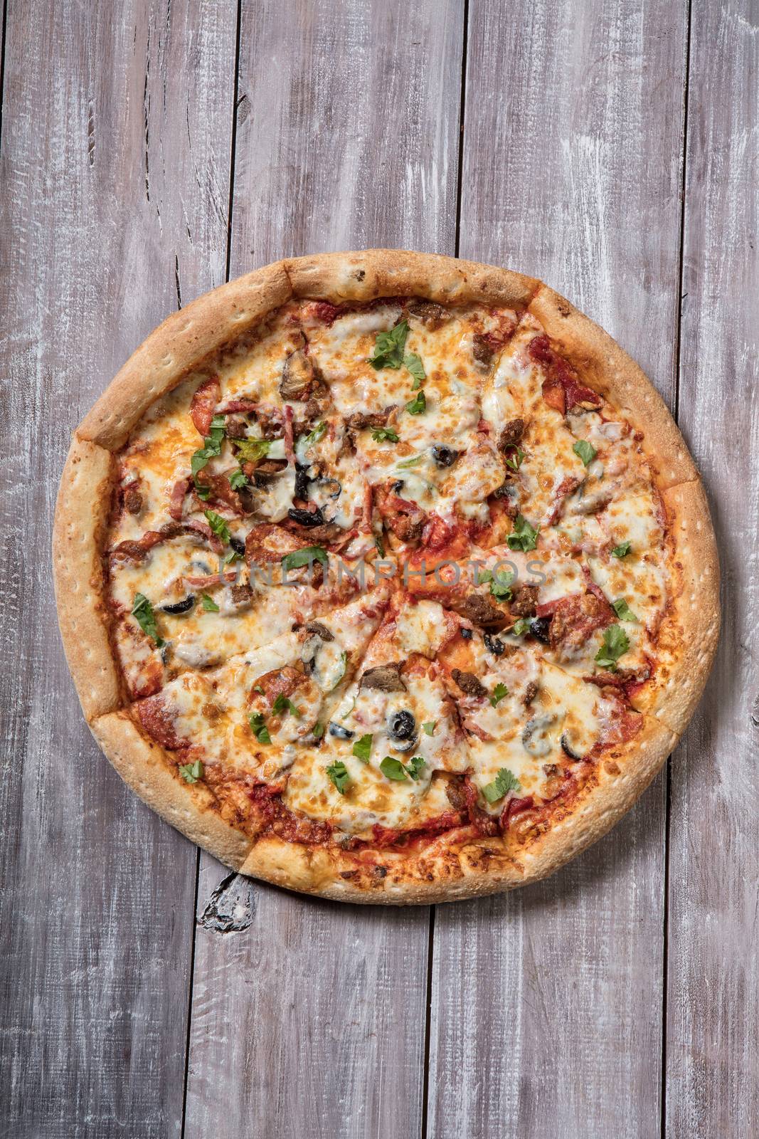 Pizza on an old wooden table