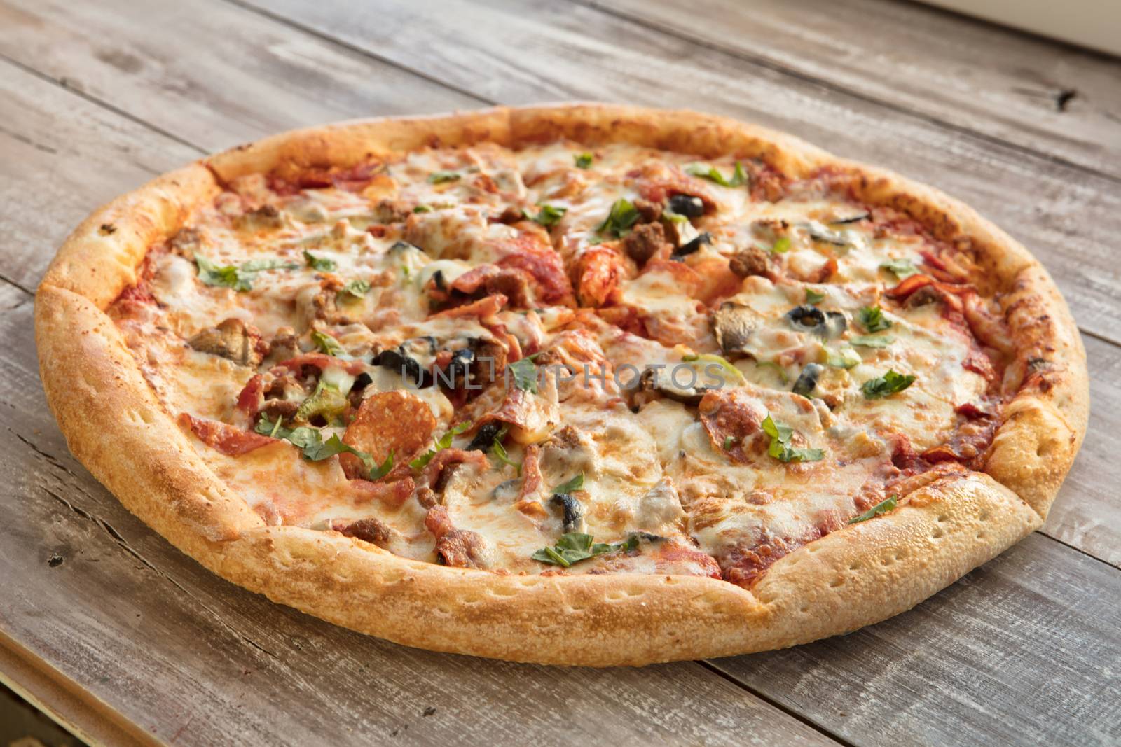 Pizza on an old wooden table