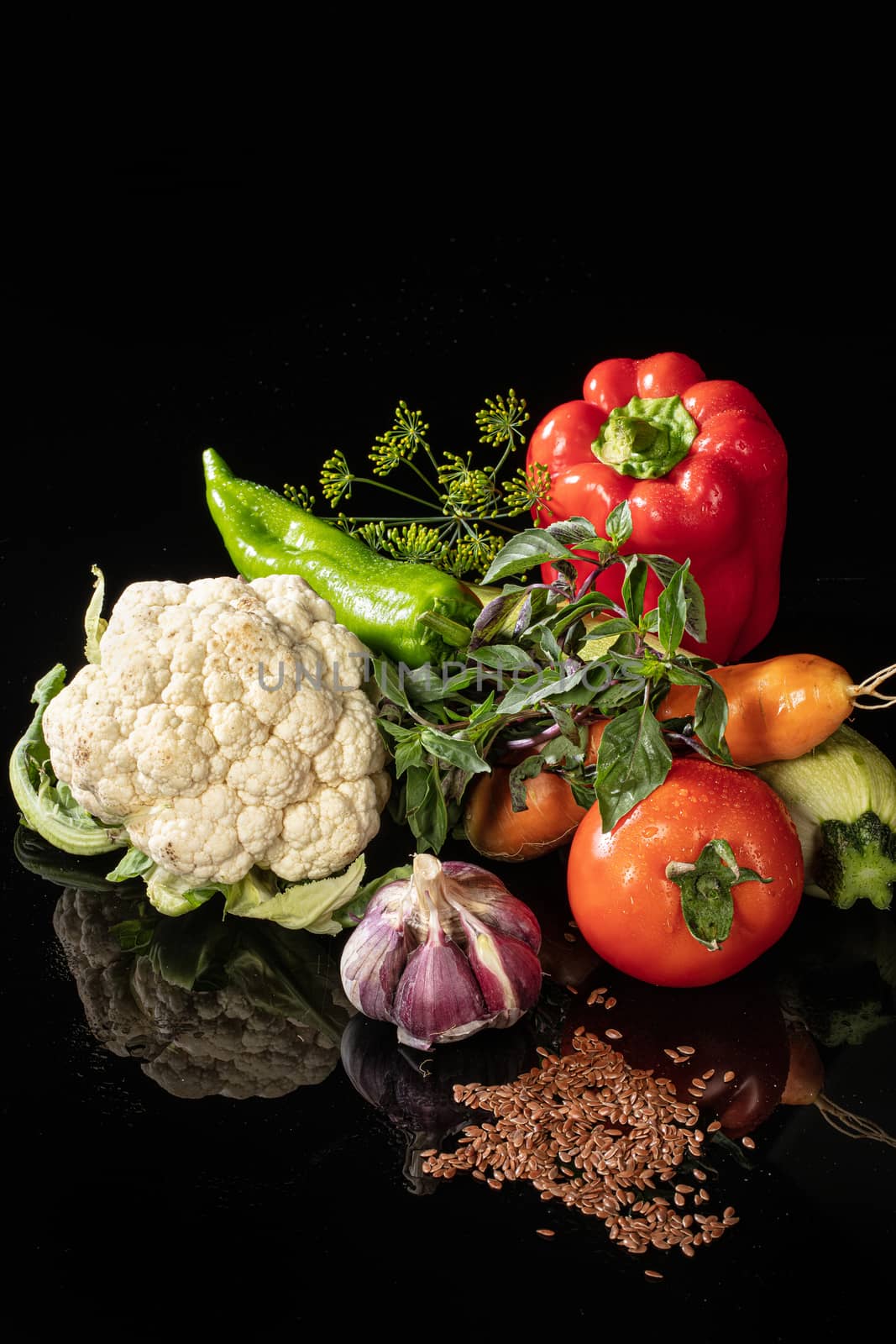 Still life with vegetables on a glass background