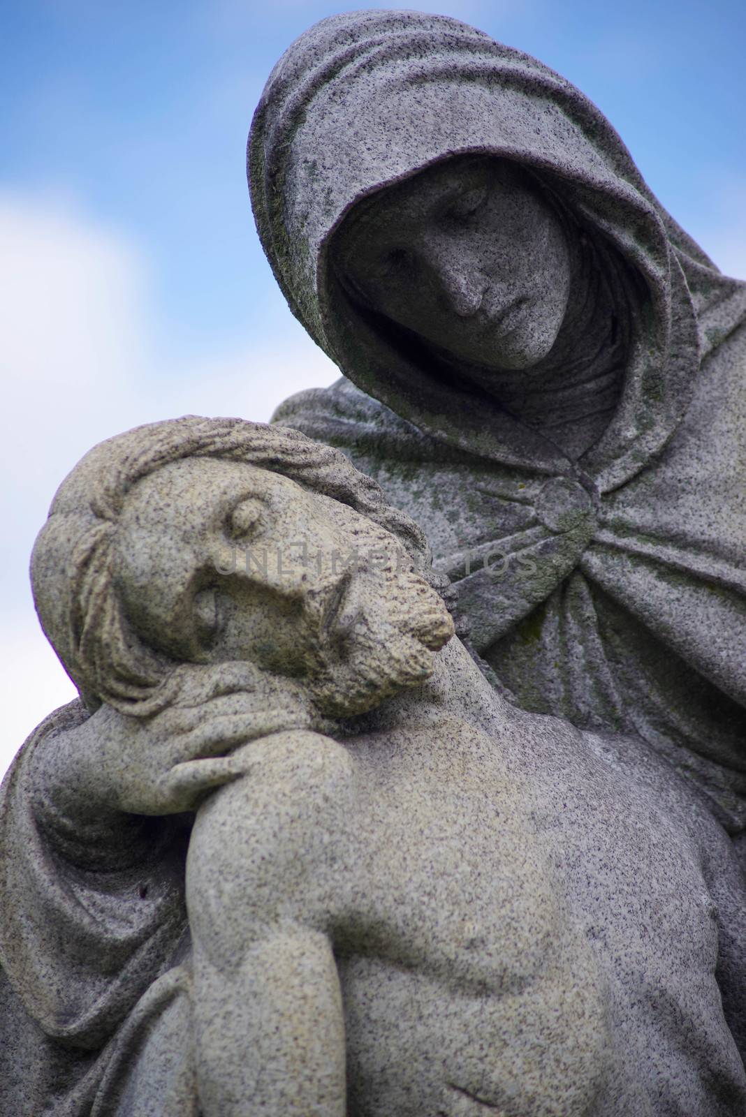 Beautiful old statue outdoors under a blue sky with copy space.