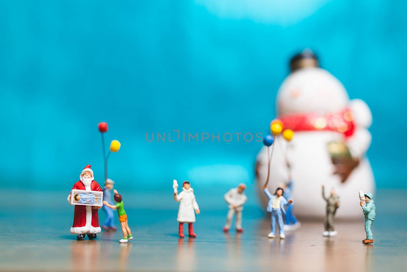 Miniature people, Happy family celebrating A Christmas by sirichaiyaymicro