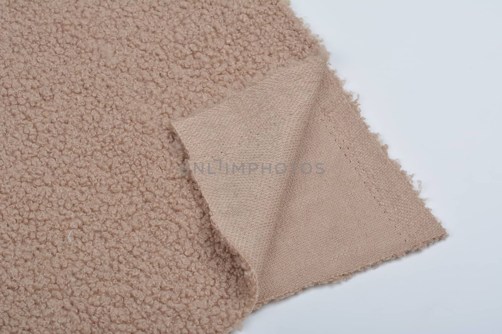 Abstract Artificial texture fur fabric, background, closeup. Fluffy material backdrop, kids toys faux fur.