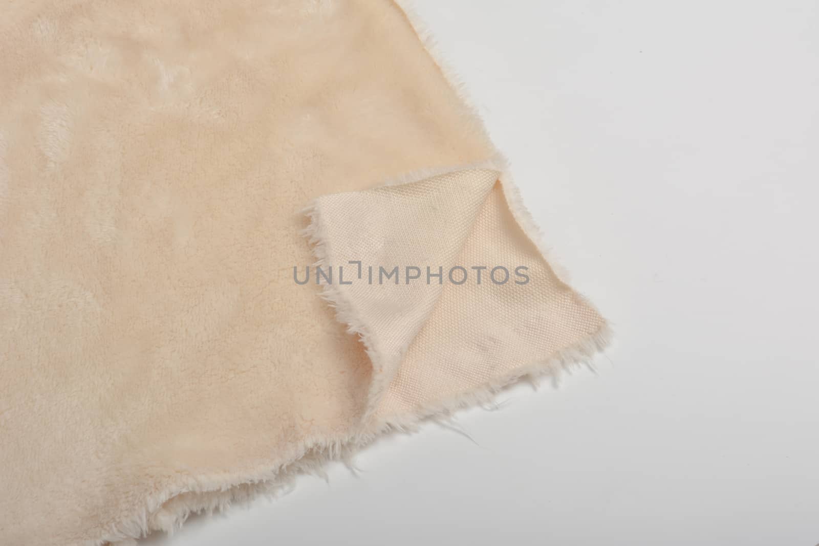 Abstract Artificial texture fur fabric, background, closeup. Fluffy material backdrop, kids toys faux fur.