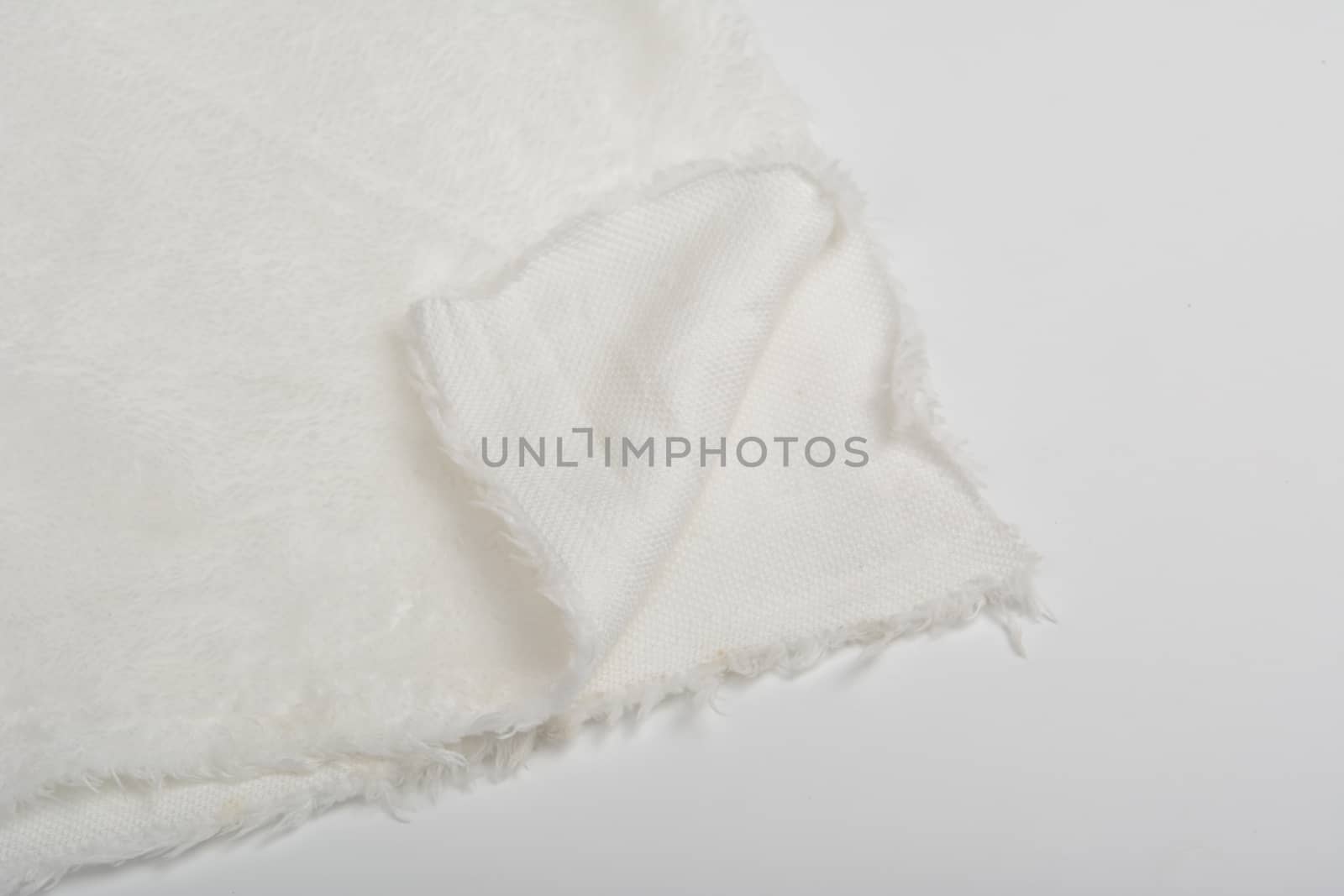 Abstract Artificial texture fur fabric, background, closeup. Fluffy material backdrop, kids toys faux fur.
