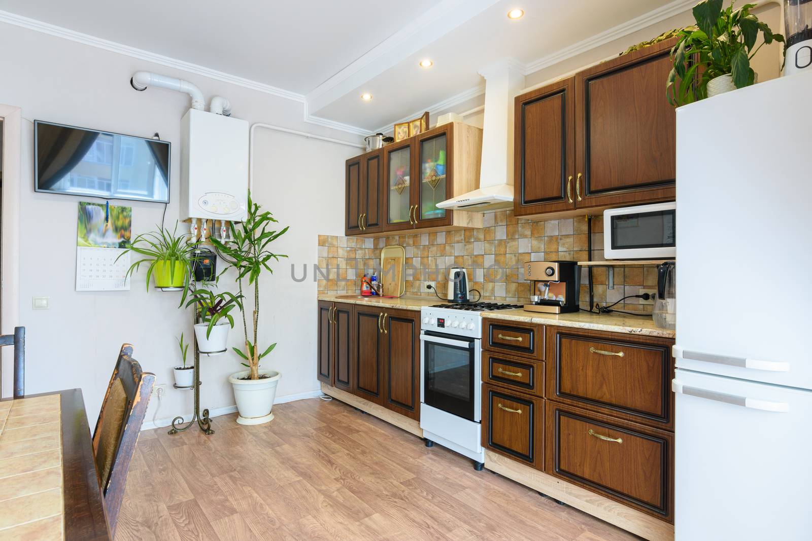 Kitchen set in a spacious living room and kitchen with an old classic wood design