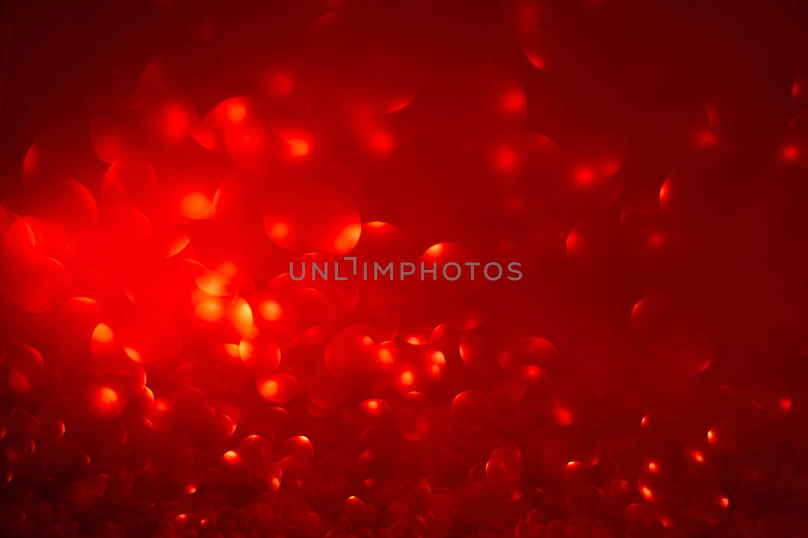 Abstract red holiday background with bokeh defocused lights with copy space for text Christmas Valentines day