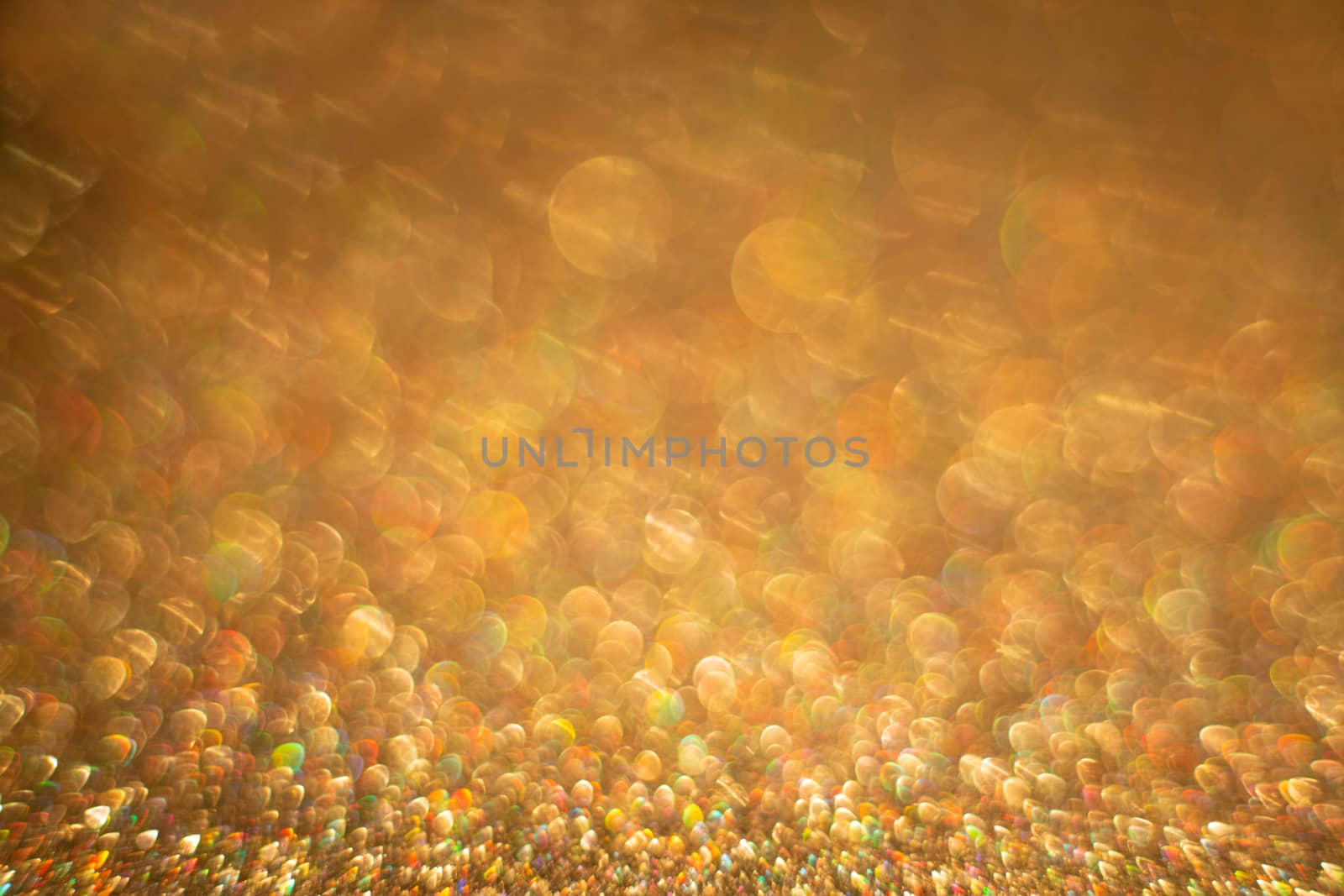 Abstract golden holiday background with bokeh defocused lights with copy space for text