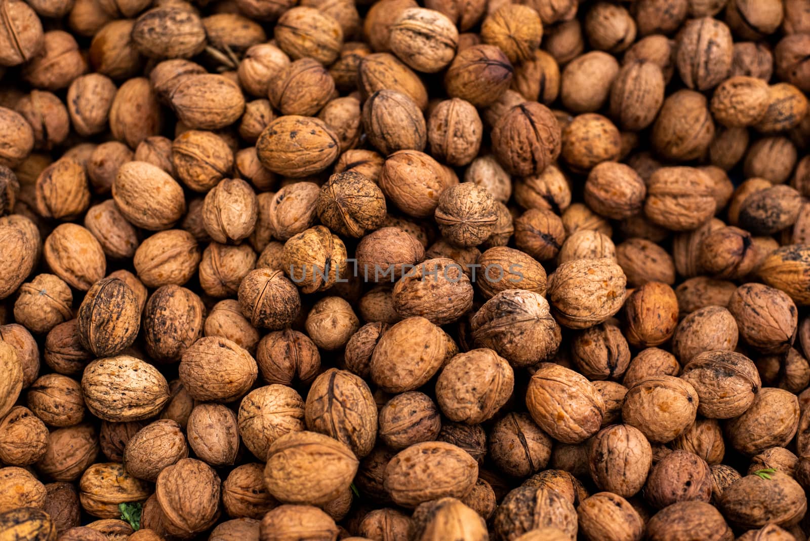 Close up of walnuts at a market by gonzalobell