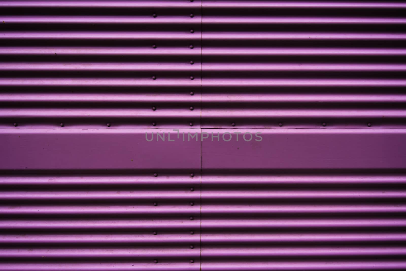 Abstract of a metal entrance in pink or purple colors by gonzalobell