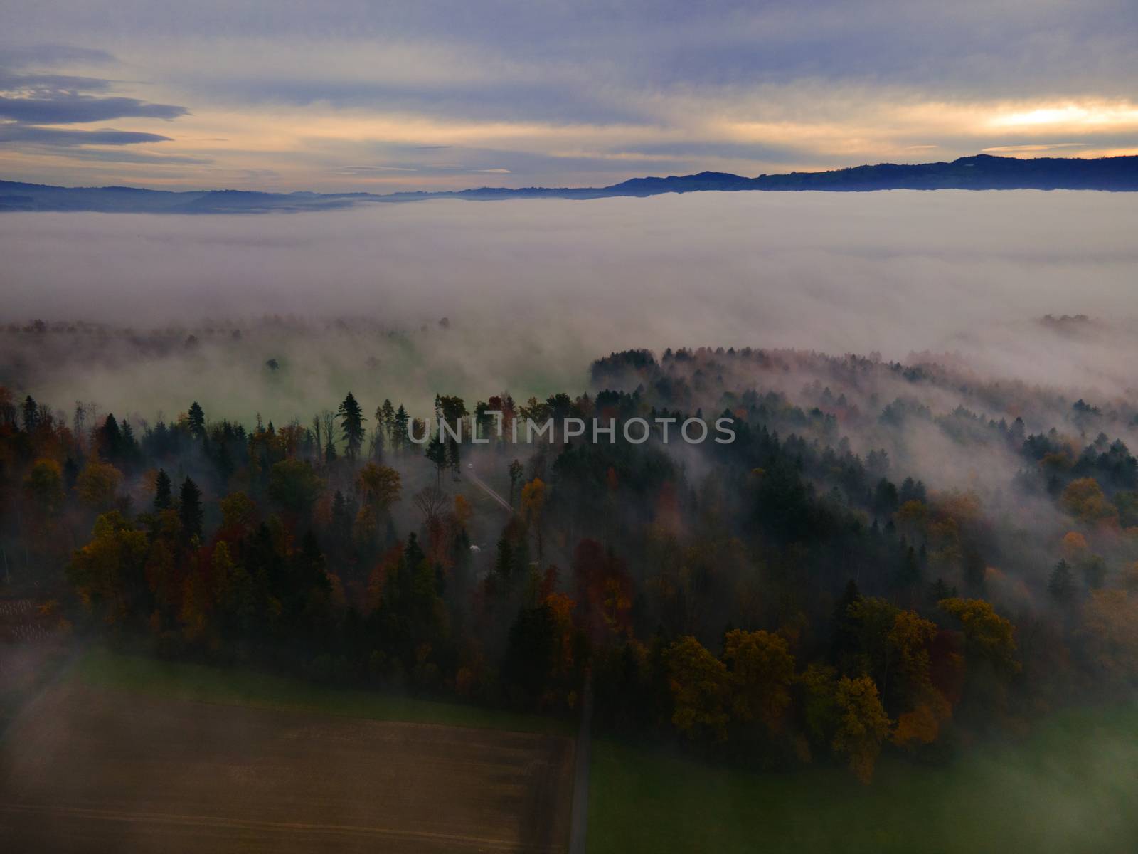 Panoramic foggy landscape with mountains in morning