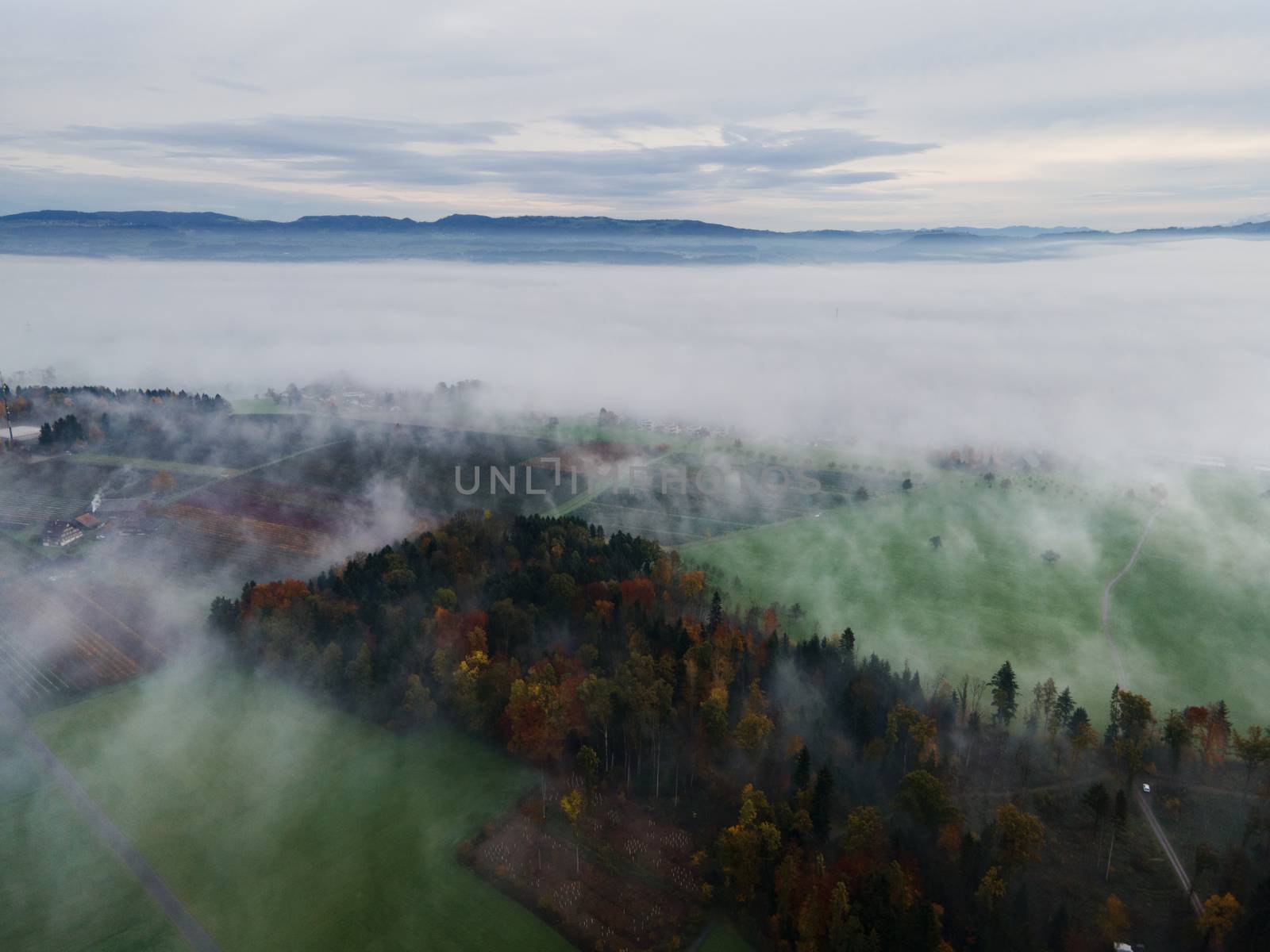 Panoramic foggy landscape with mountains in morning. Landscape by PeterHofstetter