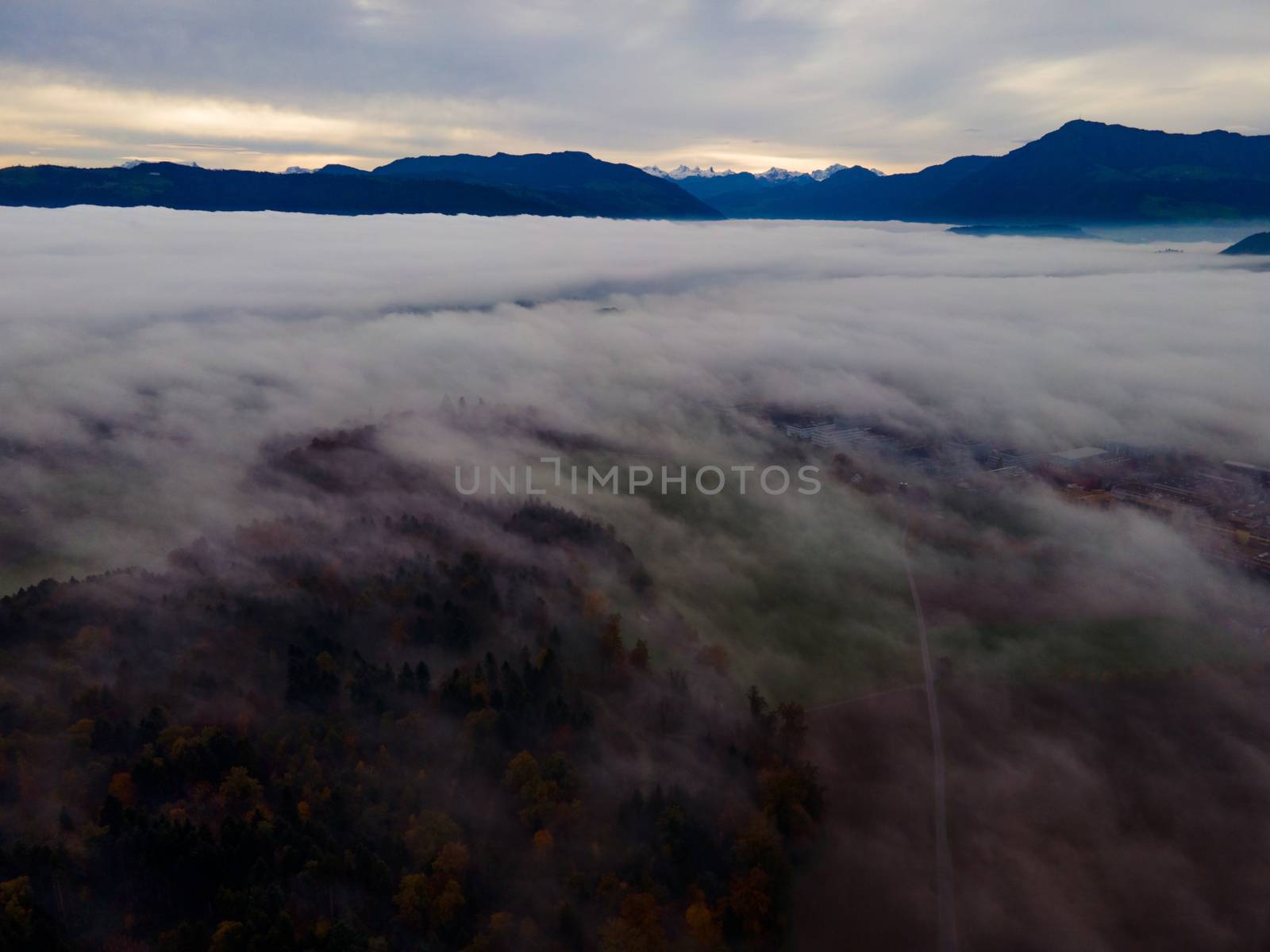 Panoramic foggy landscape with mountains in morning