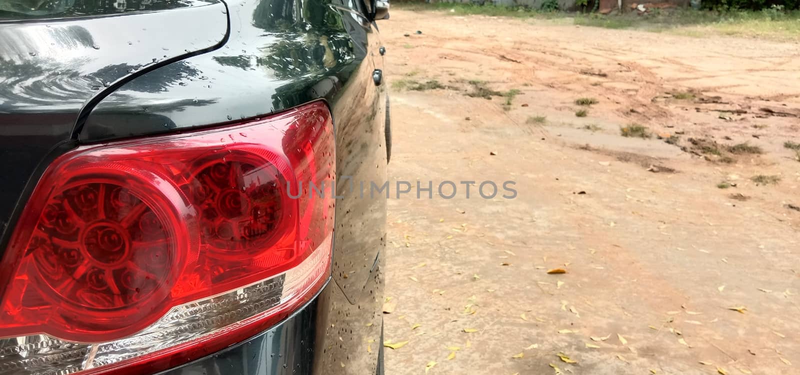 back light of black colored car on road