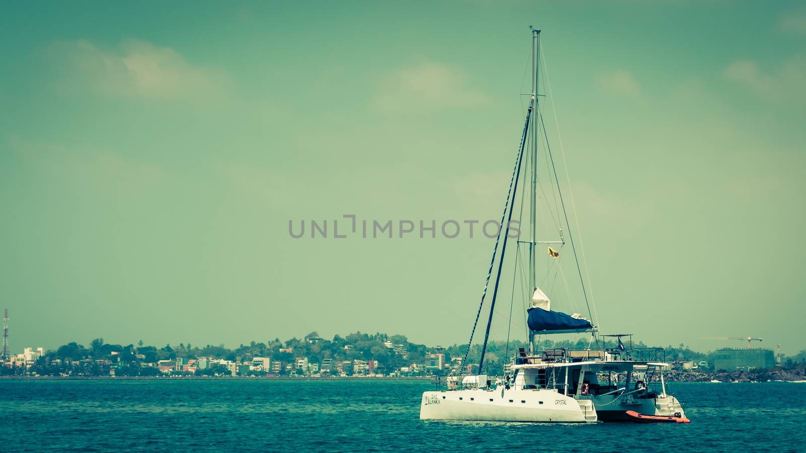 yacht boat sitting idle at jungle beach Galle