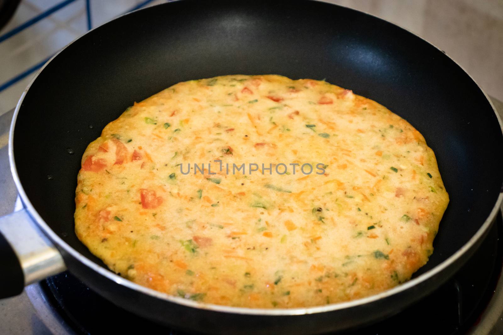 easy Egg-Oats omelette cooking on a pan