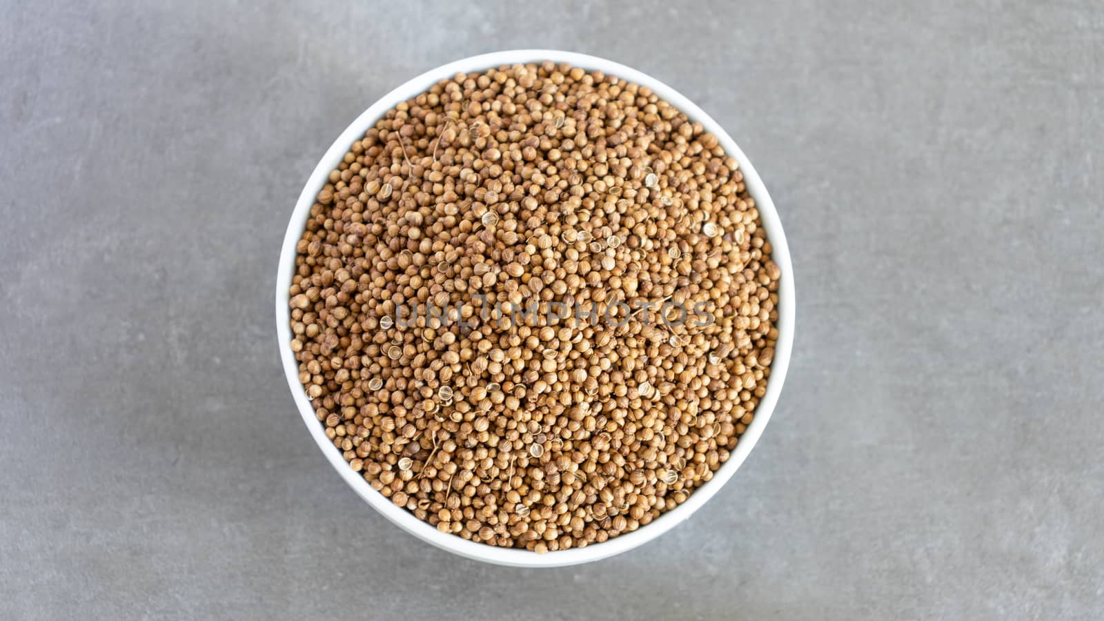 Coriander Seeds Bowl Top View Neutral background with negative space to add captions by nilanka