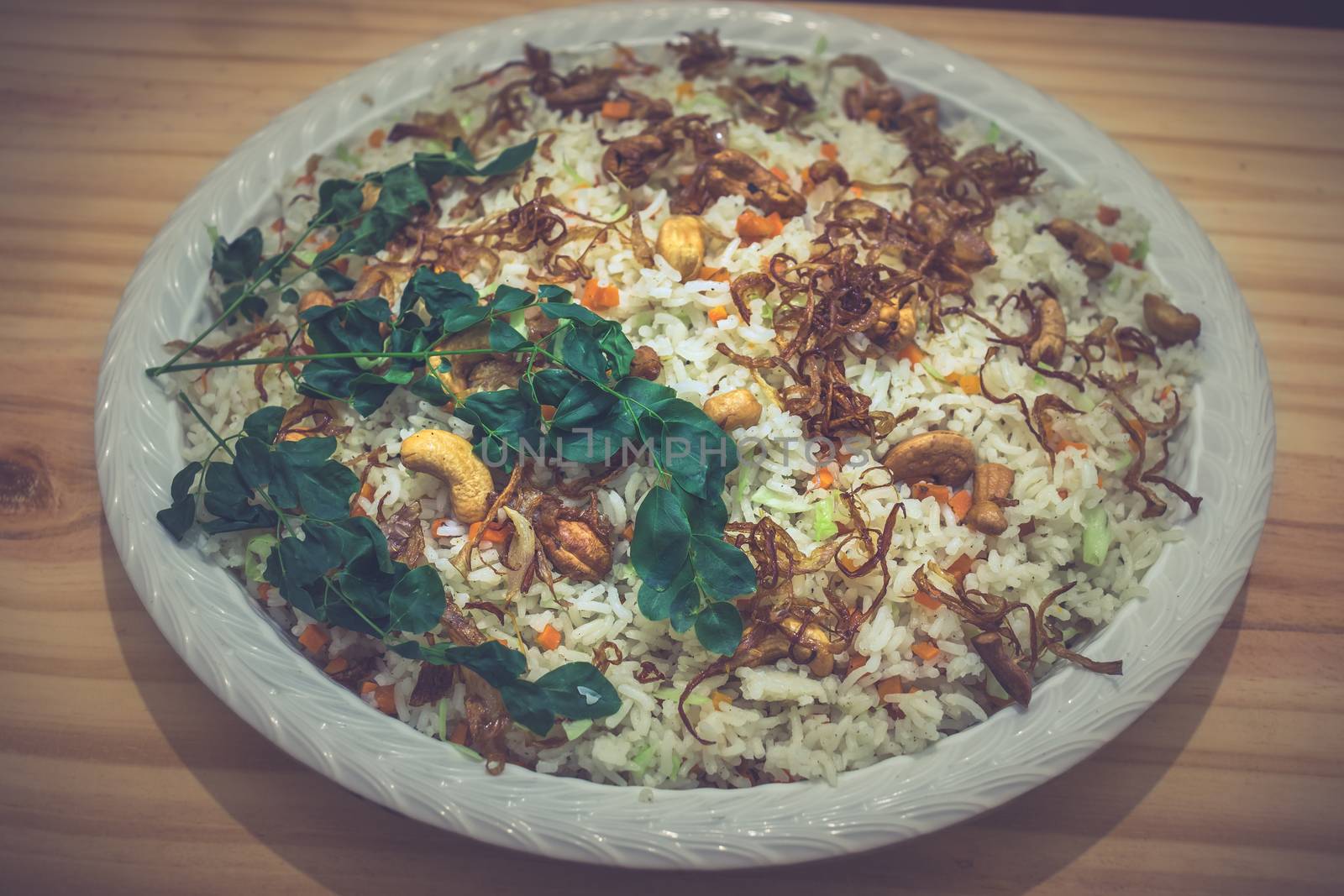 Basmati fried rice plate on a dinner table by nilanka