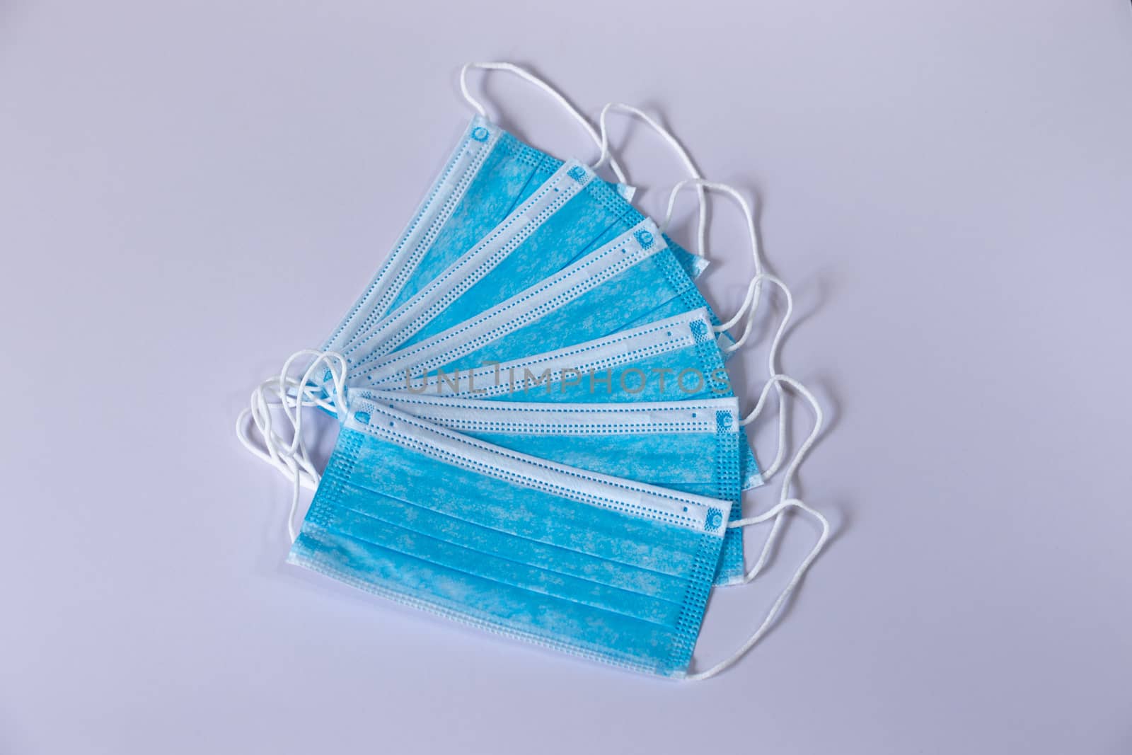 Surgical protective Face Masks spreads spiral white background