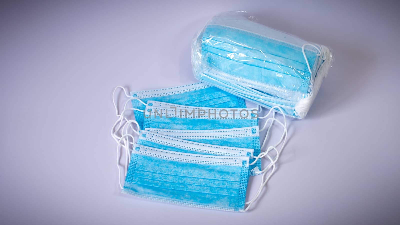 Surgical protective Face Masks spreads around with mask box white background