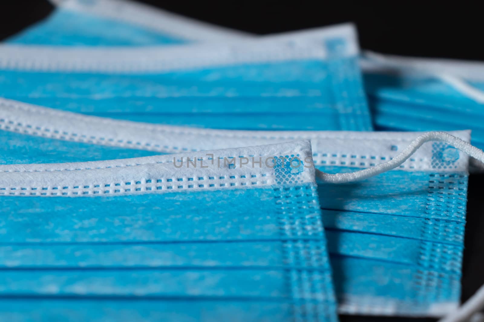 Surgical masks close up dark background