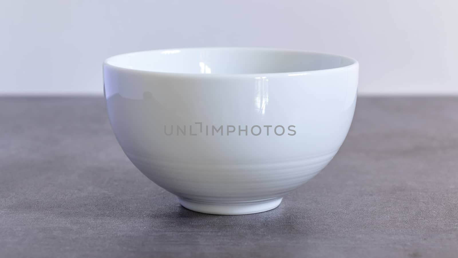 Empty polished white Ceramic bowl close up by nilanka