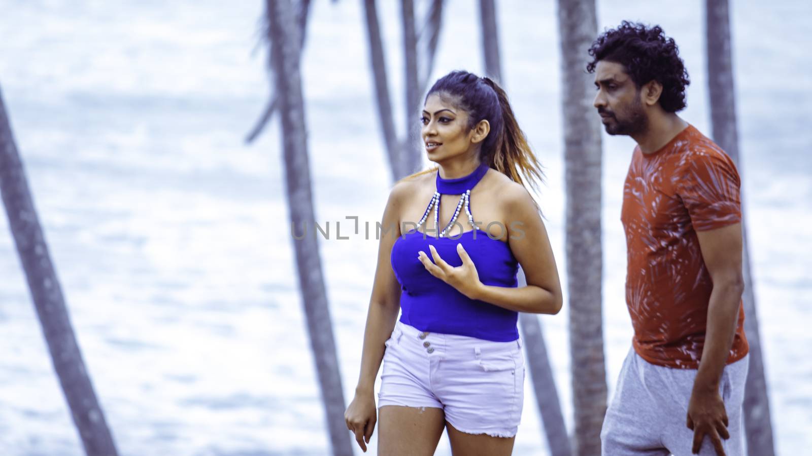young beautiful Sri Lankan couple in beach location post covid situation by nilanka