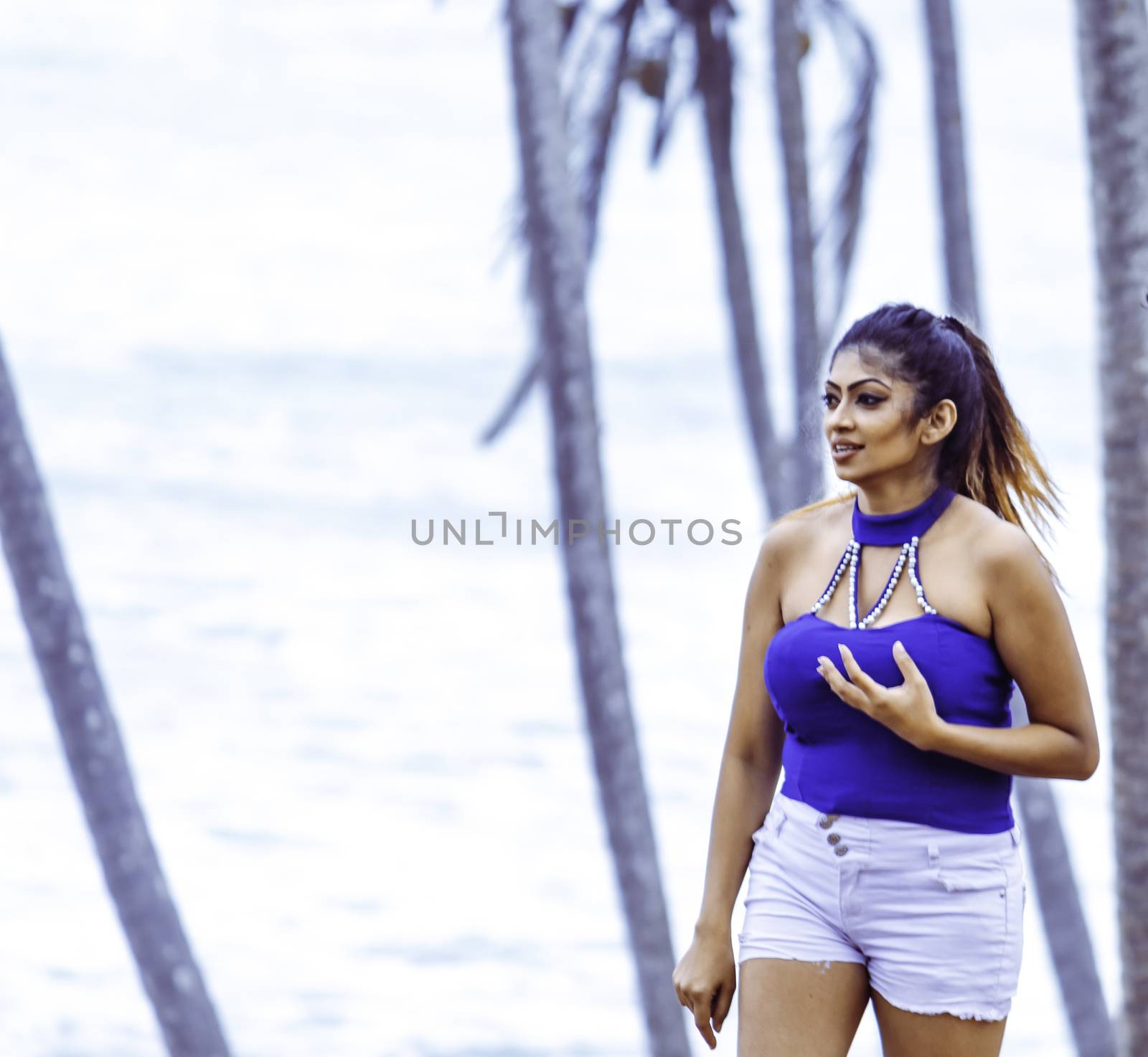 young beautiful asian hot model in blue top Mirissa beach location by nilanka