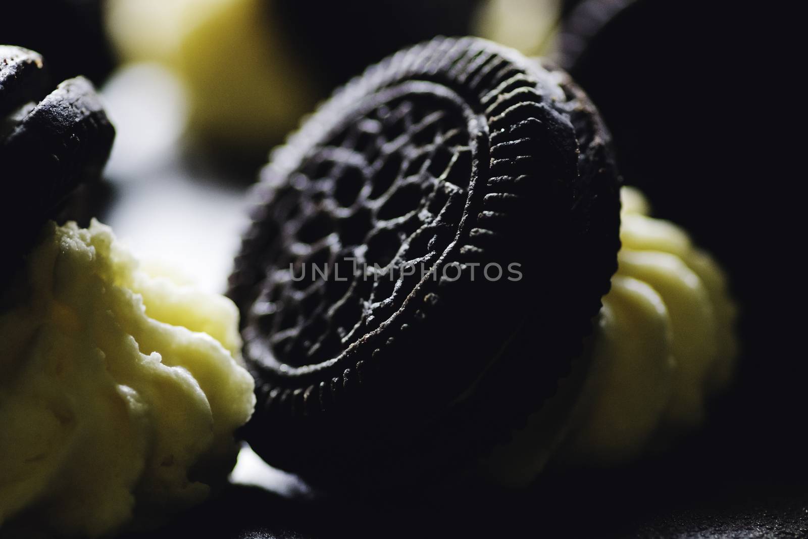 Chocolate icing cake dark chocolate biscuits on topping close up macro