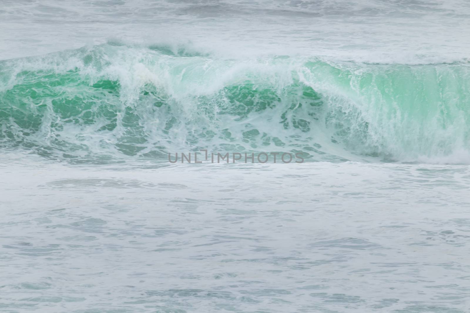 Tides crashing and splashing nice clear blue water in the Indian ocean.